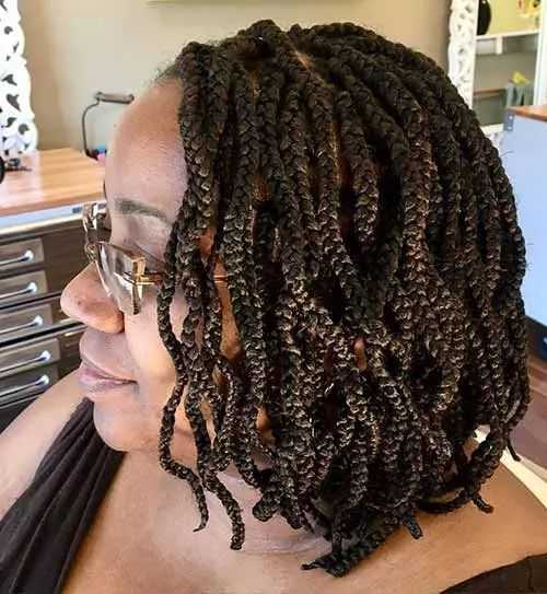 A-black-woman-in-a-black-layered-braided-bob