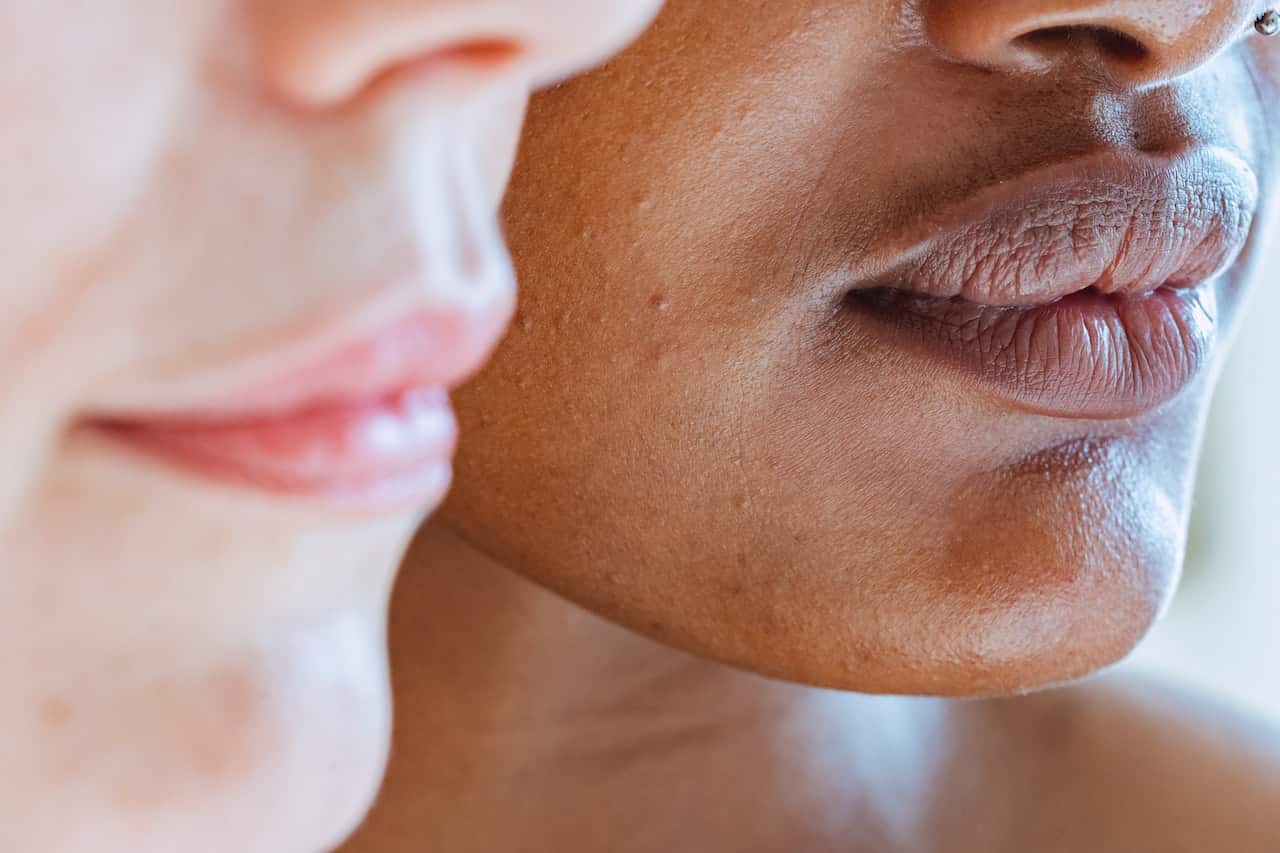 Closeup-of-Black-woman's-face-next-to-white-woman's-face
