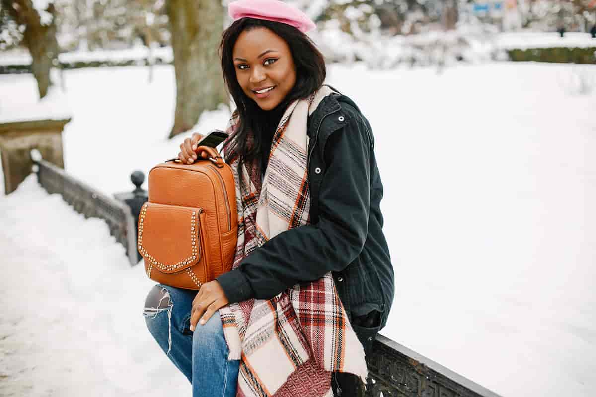 spotcovery-elegant-black-girl-in-a-winter-city-traveling-alone