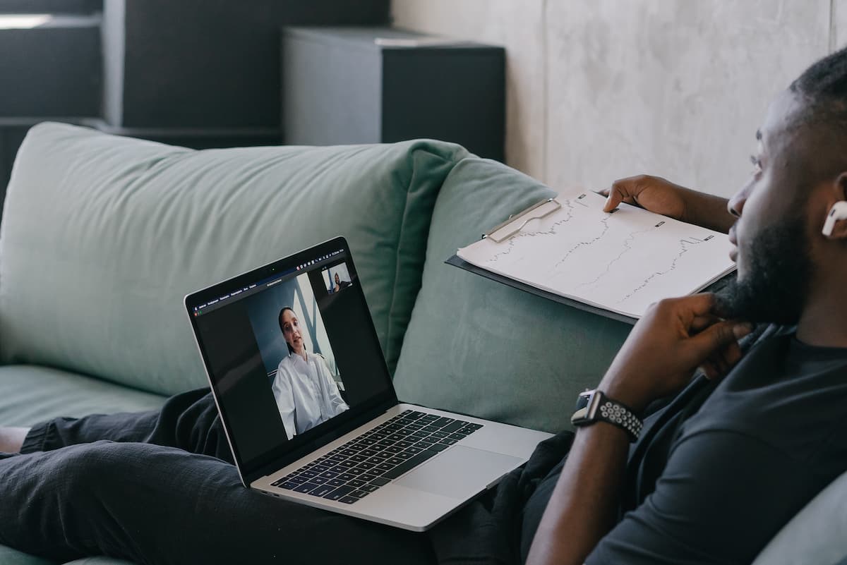 spotcovery-person-in-black-long-sleeve-shirt-using-macbook-pro- essential-tips-for-black-entrepreneurs-starting-an-online-coaching-business