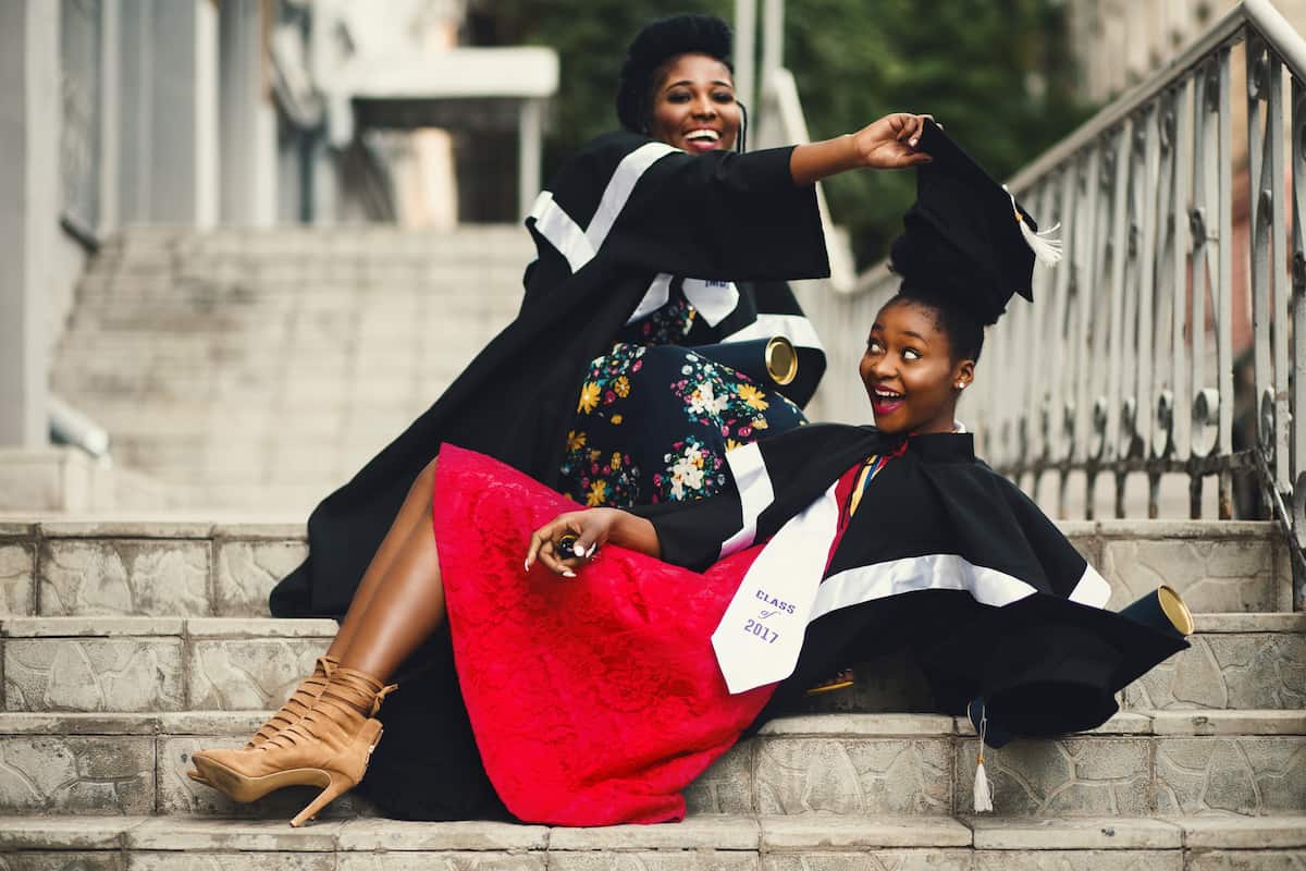 spotcovery-two-women-in-academic-dress-on-flight-of-stairs-5-remarkable-scholarships-for-black-college-students