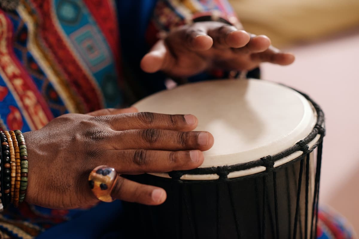 spotcoveryperson-playing-djembe-how-to-play-the-african-djembe-drum