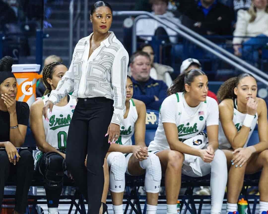 spotcovery-niele-ivey-in-a-basketball-game-niele-ivey-the-first-black-female-notre-dams-head-coach-in-history