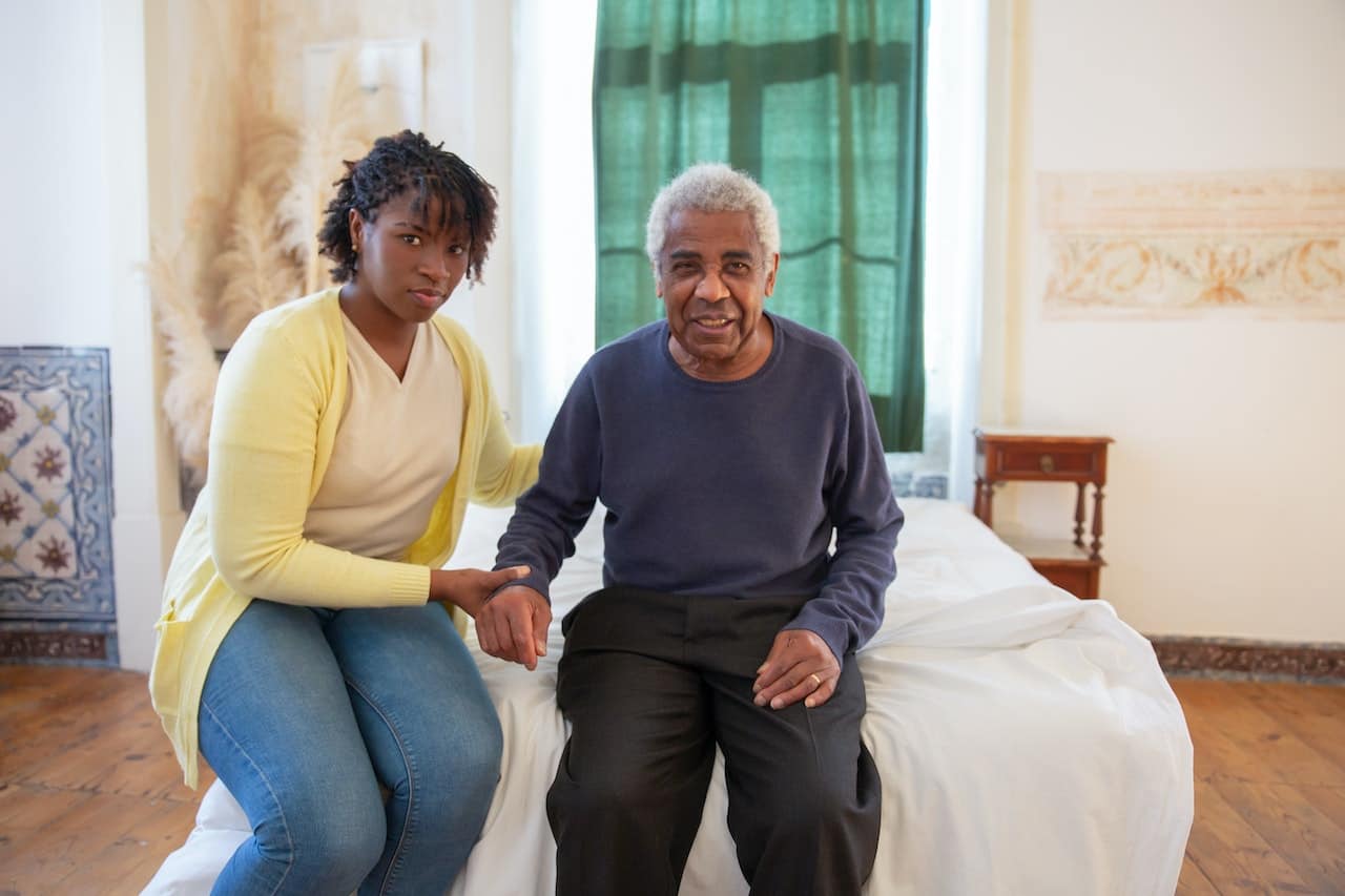 spotcovery_black_woman_with_old_man_image_source_pexels_licenced-under_cc-by-2.0