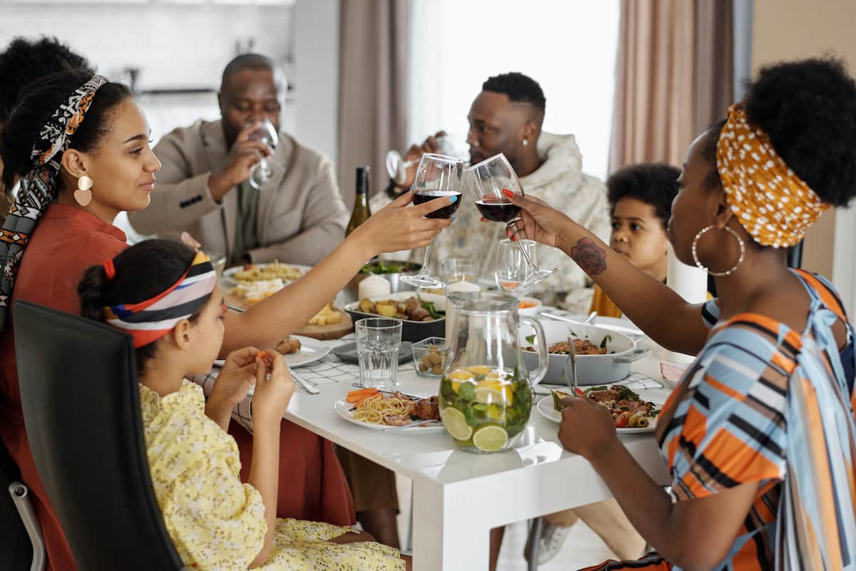 spotcovery-family-having-dinner-21-thanksgiving-event-ideas-black-families-should-adopt