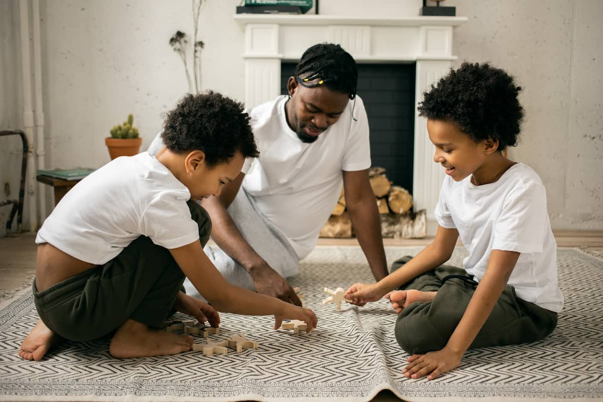 spotcovery-kids-sitting-on-carpet-black-entrepreneurship-how-to-start-a-home-based-child-care-business