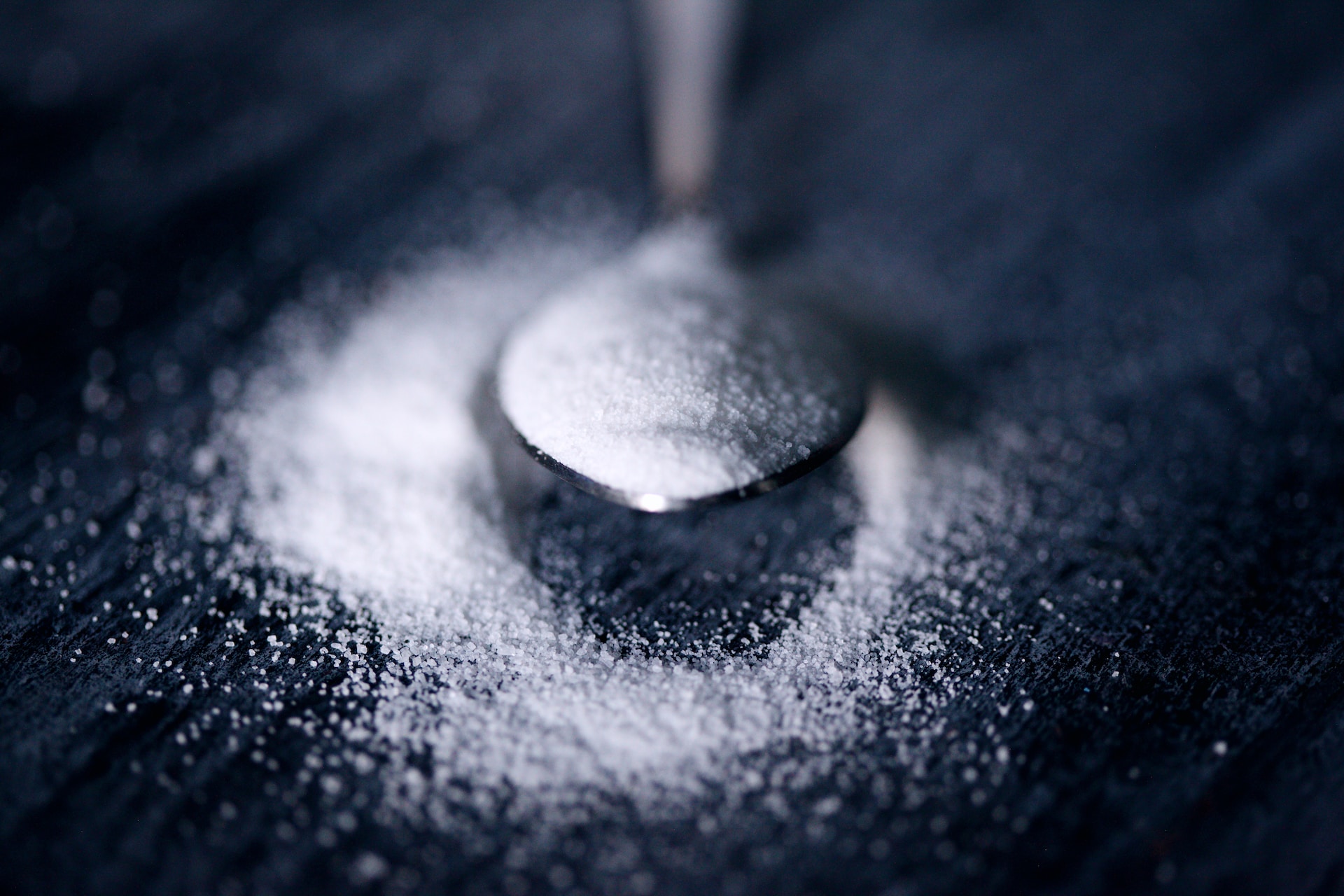 spotcovery-a-spoon-full-of-sugar-spilt-on-the-countertop-american-diabetes-month-why-black-americans-should-reduce-sugar-intake