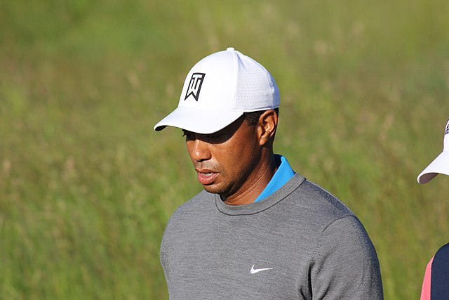 spotcovery-tiger-woods-walking-on-the-golf-course-sports-scandals-five-athletes-who-tarnished-their-reputation