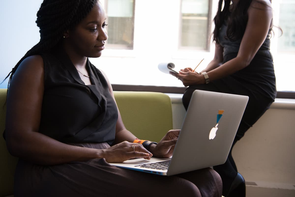 spotcovery-silver-macbook-on-woman-s-lap-what-can-be-done-to-promote-black-entrepreneurship-strategies-for-success-and-empowerment
