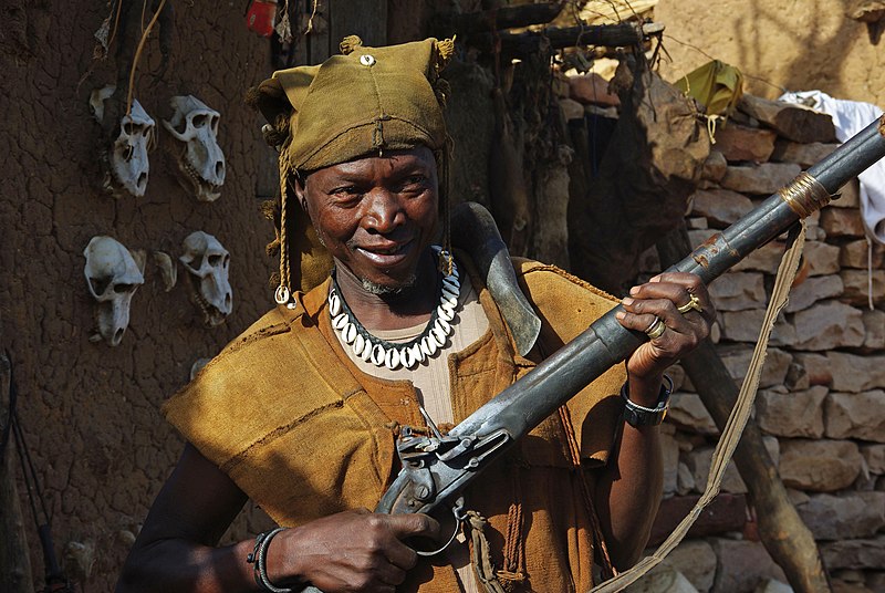 Spotcovery-African-man-holding-a-gun-conflicts-in-Africa