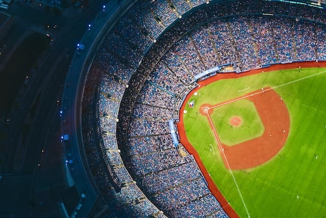 spotcovery-A baseball field with fans in the stadium watching