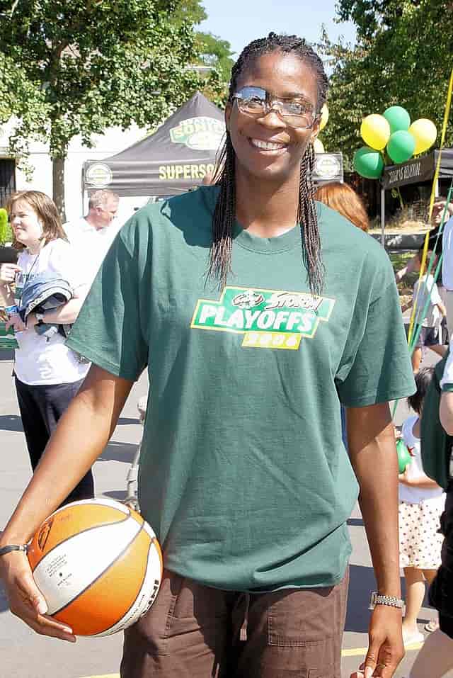 spotcovery-simone-holding-a-basketball-simone-edwards-first-caribbean-and-jamaican-female-in-the-wnba