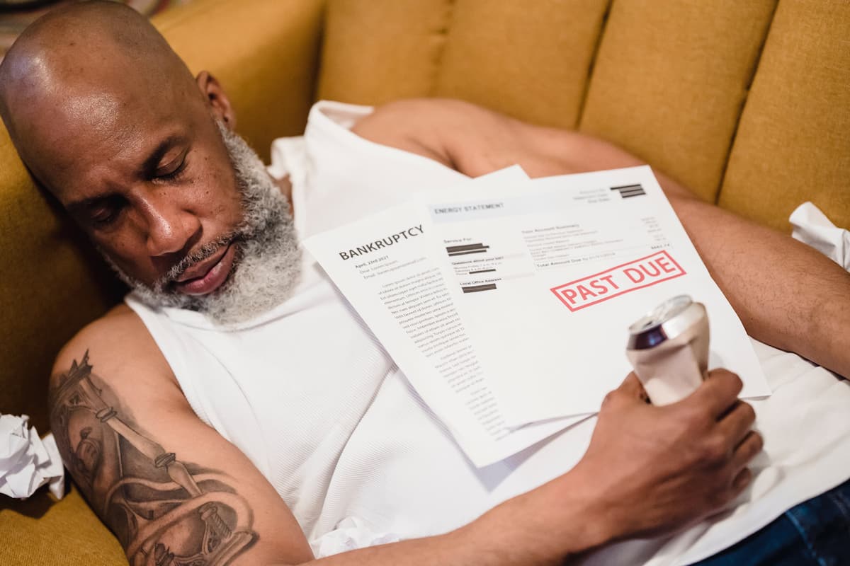 spotcovery-bearded-man-with-a-tattoo-sleeping-the-link-between-money-worries-and-mental-health-in-african-american-community