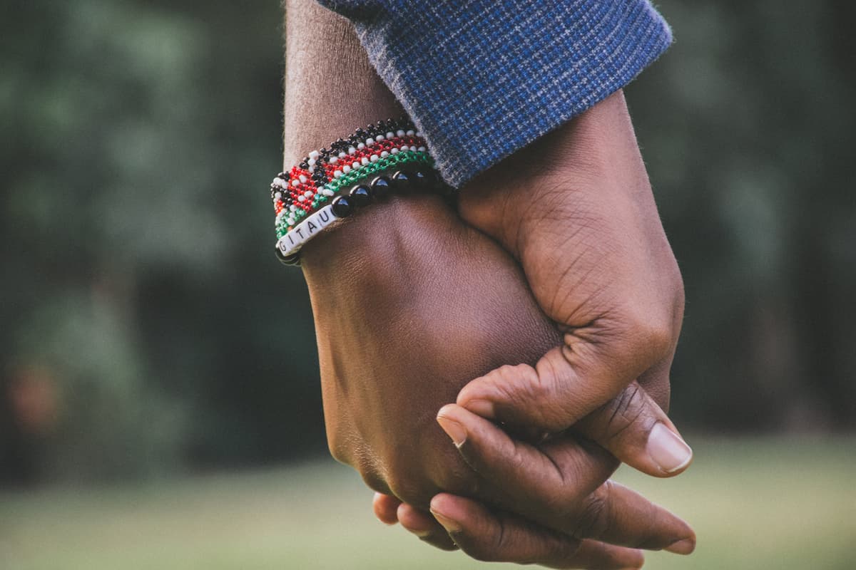 spotcovery-black-couple-holding-hands-what-to-do-if-your-spouse-is-bad-with-money-6-top-financial-advice-for-black-couples