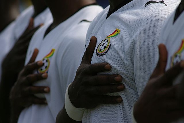 spotcovery-ghana-players-place-hands-on-chest-during-a-game-seven-best-football-kits-at-afcon-you-should-buy