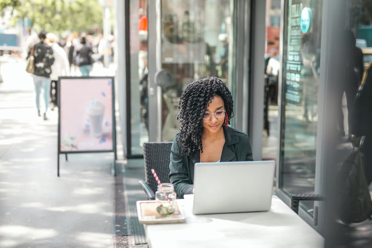 spotcovery-black-young-woman-using-laptop-how-to-get-a-raise-at-work-without-asking-6-strategies-african-americans-should-know
