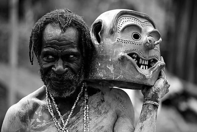 spotcovery-a-papua-new-guinea-man-holding-a-mask-skeleton-tribe-8-interesting-facts-about-the-chimbu-people-of-new-guinea