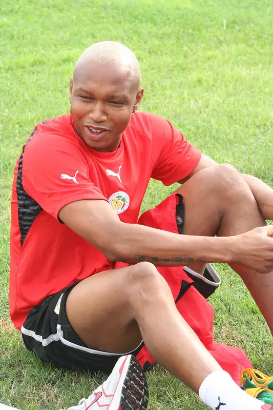 spotcovery-el-hadji-diouf-sitting-on-a-ball-from-glory-to-the-dock-african-footballers-who-faced-the-law-in-europe