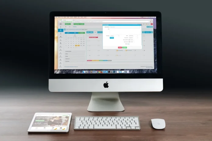 spotcovery-silver-imac-apple-magic-keyboard-and-magic-mouse-on-wooden-table-how-to-uninstall-apps-on-a-mac-a-step-by-step-guide-to-freeing-up-space